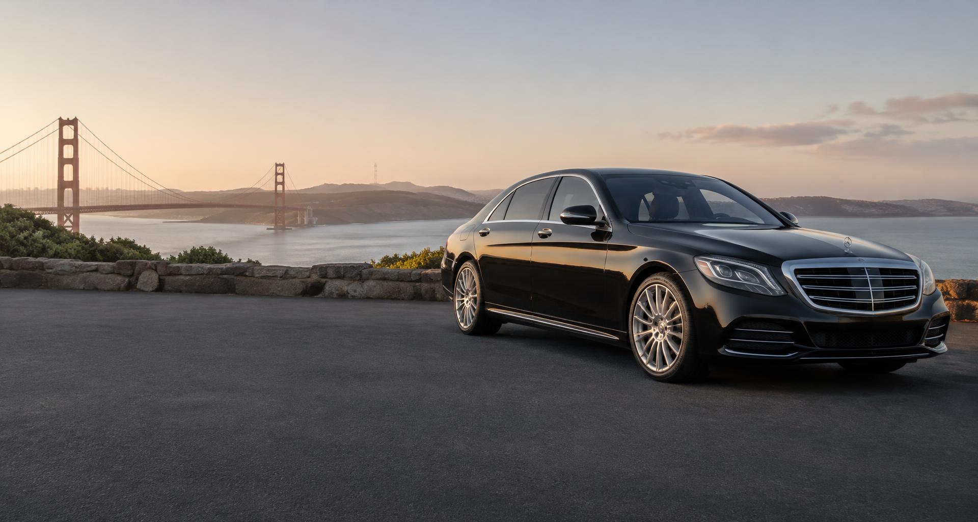 Black luxury sedan overlooking San Francisco Bay and the Golden Gate Bridge